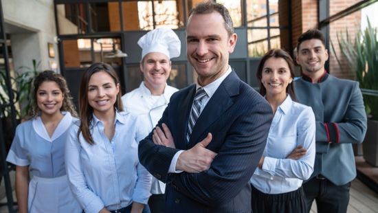 A hotel team of Manager, Chef, Concierge and Chamber Maids